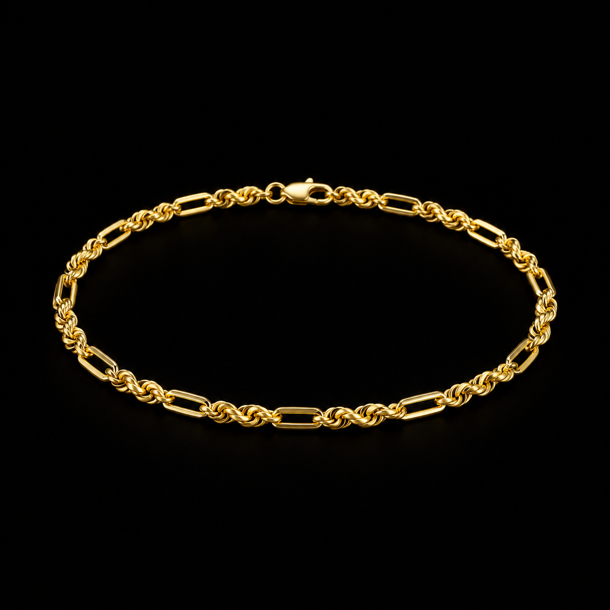 Pulso torsal fígaro de oro amarillo de 2 mm sobre fondo negro, vista completa del tejido