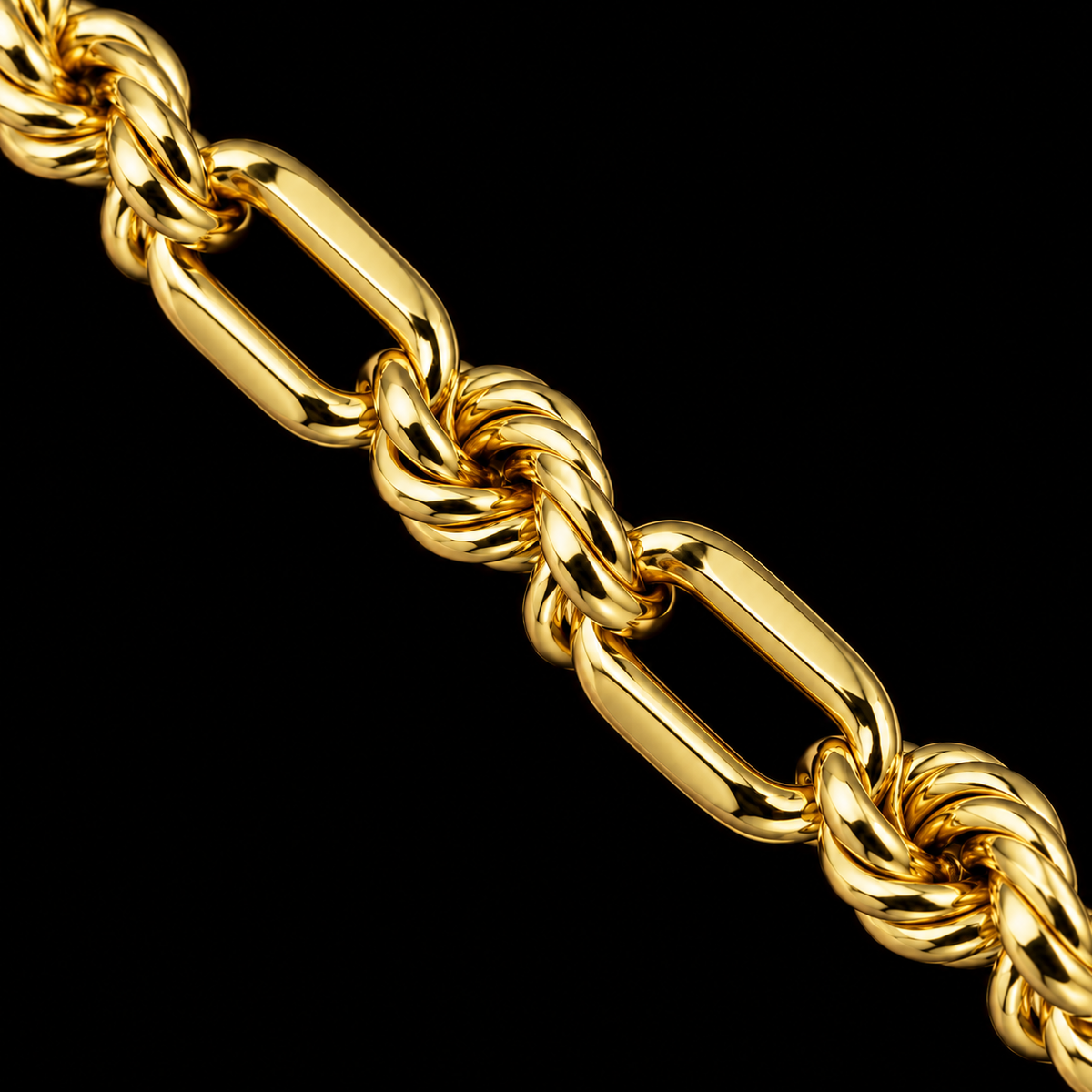Macro del tejido torsal fígaro de oro amarillo de 5 mm con eslabones alargados y tramos torsal